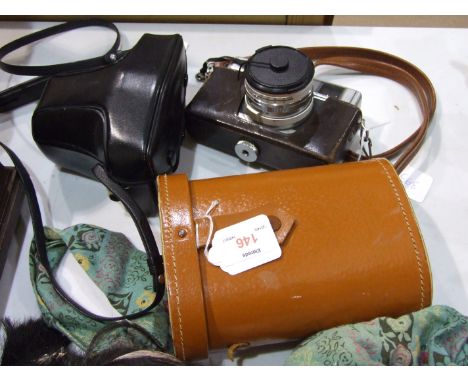 An Olympus OM10 camera, a Minolta Hi-Matic 7 camera and a pair of Simor binoculars, (12x50 extra wide angle 60 degrees), (3).