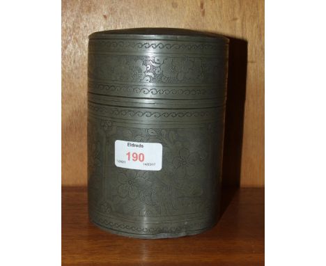 An oriental pewter cylindrical tea caddy with inner cover and lid, 12cm diameter, 15.5cm high.