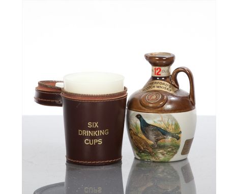 RUTHERFORD'S 12 YEAR OLD Blended Scotch Whisky in Montrose Potteries crock with wildfowl illustration. 6 2/3 fl oz, 70 Proof.