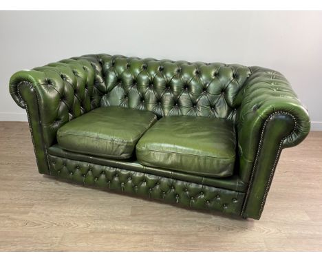 GREEN LEATHER CHESTERFIELD SUITE, comprising a three seat and a two seat settee, a wing back armchair and a footstool, all up