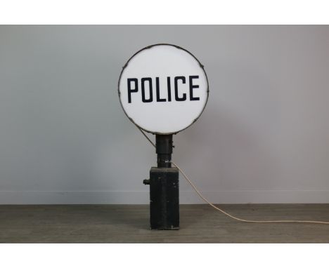 VINTAGE ILLUMINATING DRUM HEAD 'POLICE' DOUBLE SIDED SIGN, contained in a japanned metal case, on a cast metal base, 96cm hig