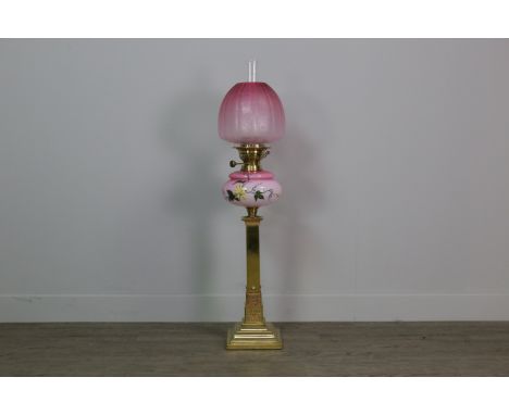 VICTORIAN BRASS SQUARE COLUMN OIL LAMP, with a floral painted pink opaque glass reservoir, with a gourd shaped, pink tinted a