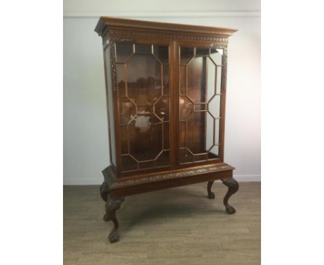 MAHOGANY DISPLAY CABINET OF CHIPPENDALE DESIGN, the moulded dentil cornice with arcaded frieze, two adjustable glass shelves 