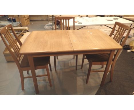 Extending dining table and four matching stick back chairs 