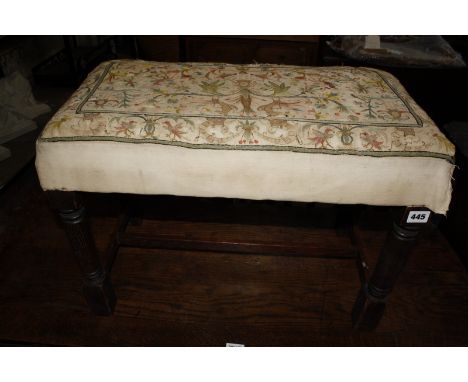 A 19th Century oak stool with earlier crewel work upholstery £80-120