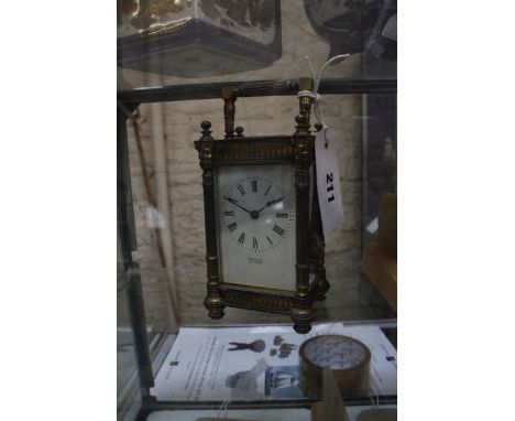 A 19th Century brass cased carriage clock, the enamel dial with Roman numerals inscribed Rowell Oxford, 16cm high (including 
