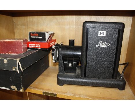 A Leitz slide projector a boxed Kodascope,cased vintage cameras and lenses. £80-120