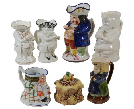 Five various Staffordshire 'snuff-taker' character jugs, various dates mostly 19th century; and a majolica example and a majo