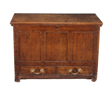 A George III oak mule chest, circa 1770, the lift top opening to large compartment with triple panel front above two short dr