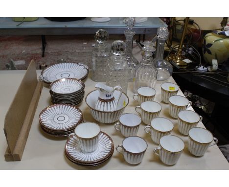 A Victorian Staffordshire part tea service, various decanters including a 19th century triple ring neck example.  Best Bid