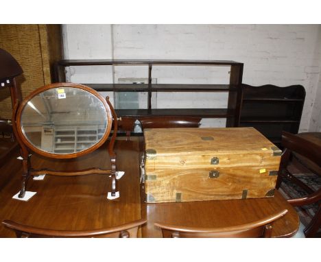 A brass bound camphor wood chest 60cm wide and an oval swing toilet mirror. £80-120