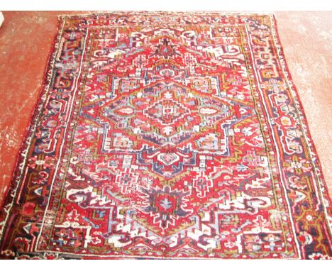 A Persian Heriz carpet 250 x 212cm £100-150