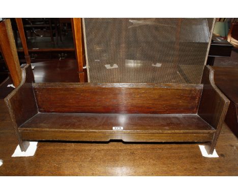 A brass framed spark guard, a brass trivet, a wood bookrack, a stool and a hammered brass umbrella stand  Best Bid