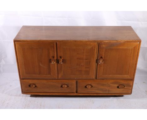 Ercol Windsor model 468 elm sideboard, c1960s, having a twin door cupboard alongside a single door cupboard with drawer, abov