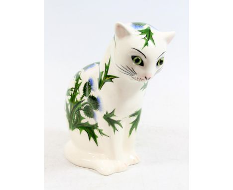 Wemyss Griselda Hill pottery cat figurine with green glass eyes, body decorated with thistles, H25cm. 