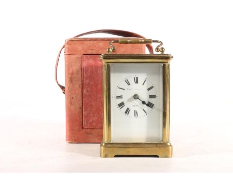 Early 20th century French brass cased carriage clock, the white dial with black Roman numerals and indistinct Calcutta retail