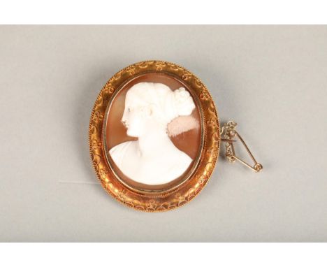 15ct gold mounted carved cameo shell brooch with portrait of a lady facing left, the border with filigree decoration, stamped