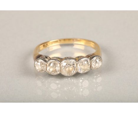 18ct gold diamond five stone ring, the central diamond approximately 0.5ct, flanked by 0.3ct and 0.25ct stones, estimated tot
