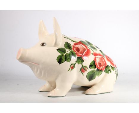 Large Griselda Hill Wemyss pottery pig, the body hand painted with roses, L45cm, H29cm. The pig is crazed throughout but ther