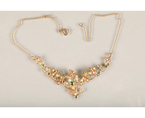 Edwardian Belle Epoque style greenstone and seed pearl necklace, the small round cut green stones and split pearls on a scrol