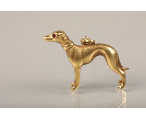14ct gold greyhound pendant, the realistically modelled pendant set with faceted ruby eyes, L2.7cm, 4.0g. 