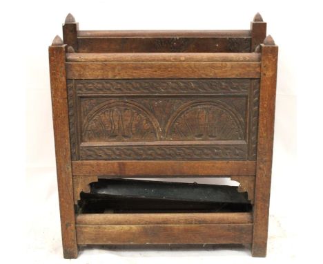 Victorian carved oak stick stand, of a Gothic style, the front panel carved in half moon and flame decoration, with inset met