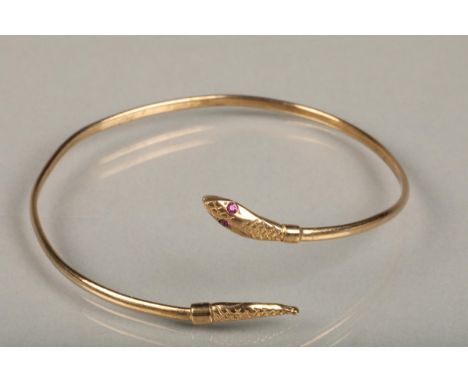 9ct gold filled snake bangle, the snake head with pink gem set eyes, internal W6.5cm, gross 4.4g. 