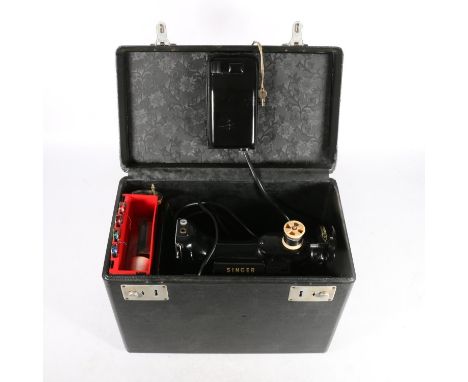Singer 222K model compact sewing machine in original carry case with pamphlets and accessories. Physical condition of the mac
