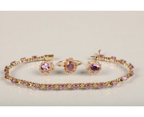 9ct gold and amethyst evening set consisting of stud earrings, a ring and a matching bracelet, in Arthur Wood Tait of Edinbur