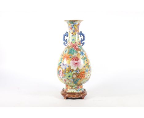 Chinese Millifleur porcelain vase, Republic period, blue archaic style handles applied on a body of polychrome peonies, chrys