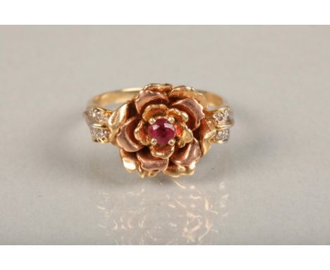 Elizabeth of Glamis Queen Mother 14ct gold rose ring, set with single cut ruby in rose form mount, flanked by diamond set lea