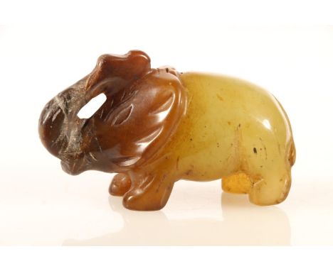 Chinese green and russet jade figurine of a standing elephant, L9cm. 