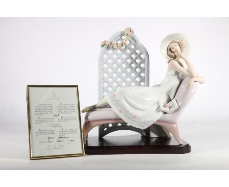 Lladro figure 'Garden of Dreams', of a woman with wide brimmed hat reclining in front of floral trellis, ltd ed. no 3728/4000