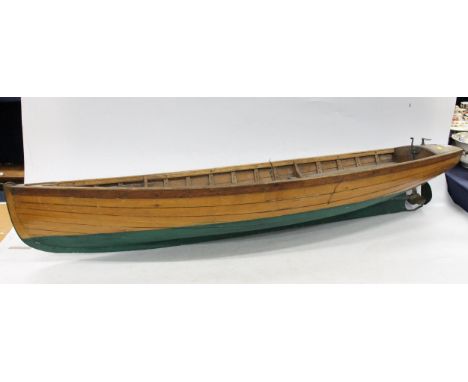 Mid 20th century model of a boat, the panelled hull with propeller and small motor, L108cm. 