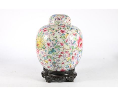 Chinese porcelain 'Millifleur' ovoid ginger jar, Republic period, the body and domed lid profusely painted in polychrome enam