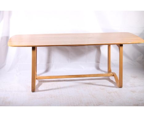 Ercol 513 shape elm and beech dining table, c1960s, the rounded elm rectangular top over a shaped beech underframe, W198cm. 