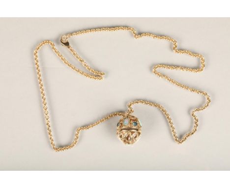 9ct gold and opal ball pendant, the round open wire work ball pendant studded with cabochon opals and blue stones, suspended 
