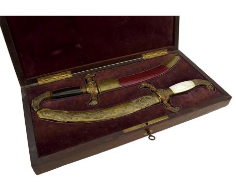 A CASED PAIR OF OTTOMAN OR TURKISH PRESENTATION DIRKS, each with 19.5cm sharply curved blade with clipped back tip and etched