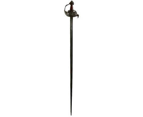 A HIGH STATUS 17TH CENTURY ENGLISH MORTUARY HILTED BACK SWORD, 96cm fullered blade incised JOHANNEX to one side and further i