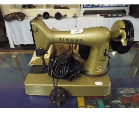 A Vintage Electric Singer Sewing Machine.