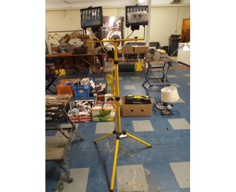 A 110 Volt Twin Halogen Tripod Light Stand (Plus Vat).
