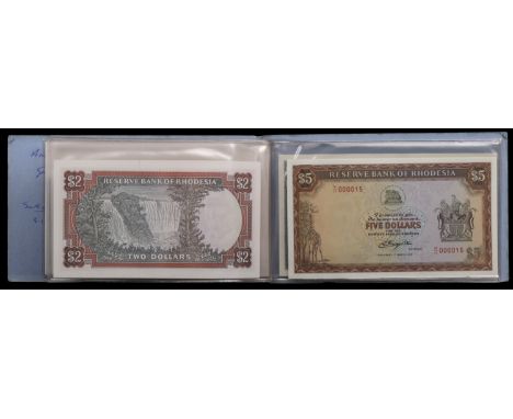 Reserve Bank of Rhodesia, a presentation wallet containing $1, $2, $5 and $10, all 1 March 1976, prefixes L/82, K/120, M//11 
