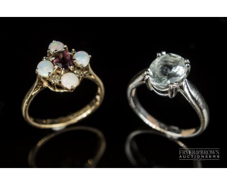 An 18 carat white gold and opal mixed cut aquamarine single stone ring; and an opal &amp; ruby 8/8 cut diamond cluster ring, 