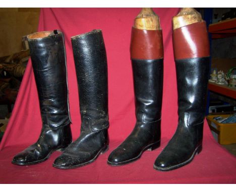 A pair of black and brown leather Hunting Boots with wooden trees, and one other pair.
