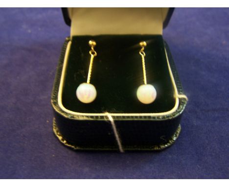 A pair of 9ct gold Pendant Earrings each set with a single opal.