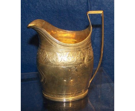 A George III silver helmet shape Cream Jug with engraved decoration and reeded angular handle, London 1796.