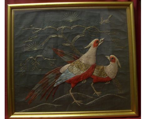 An oriental Embroidery on a silk panel of two pheasants, 18" (46cms) x 20" (51cms).