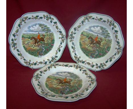 A set of three Wedgwood Plates printed and painted with hunting scene and titled "Cross Country" within a floral border, 9" (