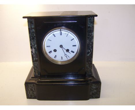 A Victorian Mantel Clock with white dial, in black slate case.  11" (28cms) high.