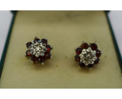 A pair of 9ct gold, ruby and diamond earrings